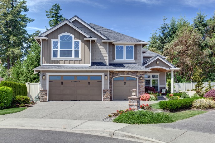 home-exterior-with-garage-and-driveway-with-nice-landscaping-desing-around